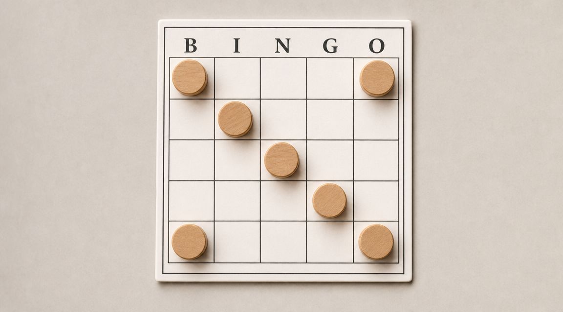 A minimalist bingo board with wooden game pieces placed in a diagonal winning pattern on the grid.